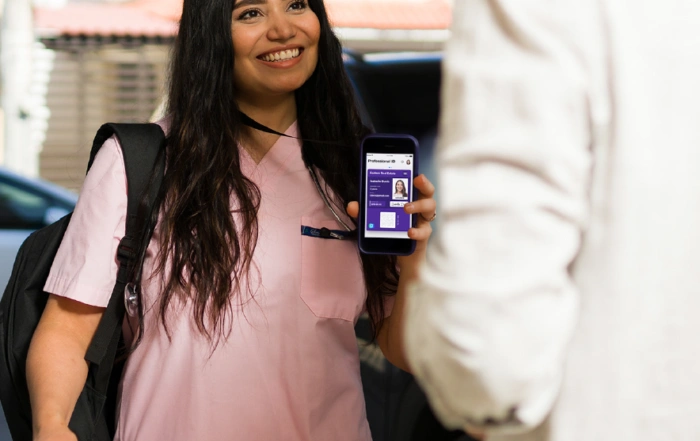 Caregiver Showing Digital ID Card
